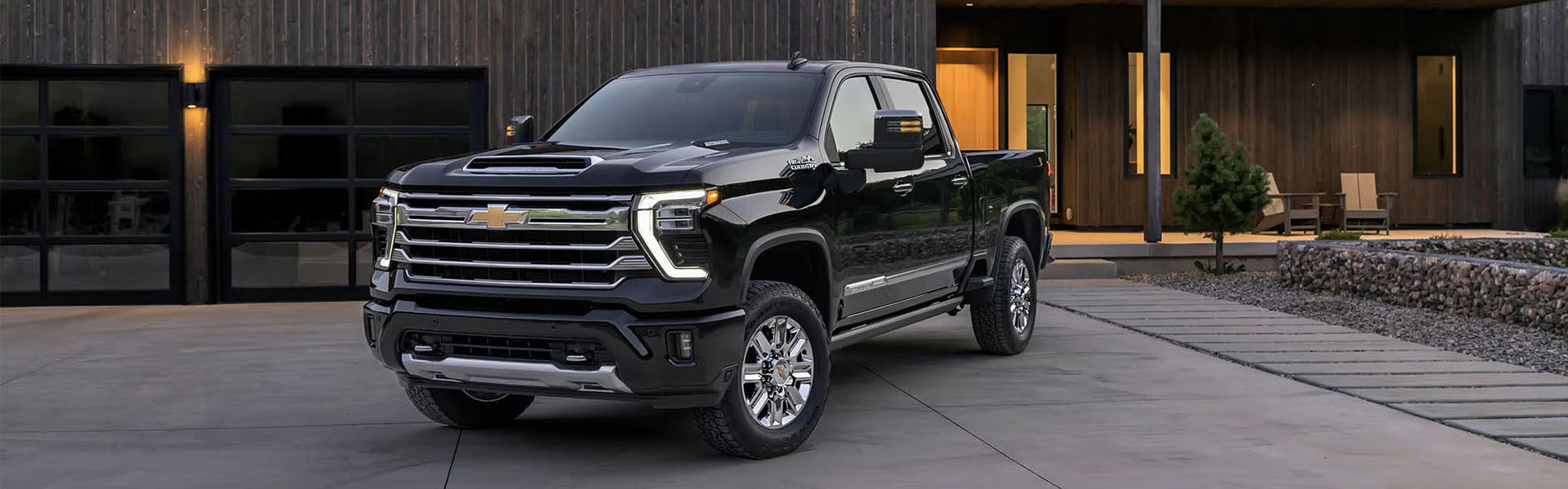 Chevrolet Silverado truck parked outside modern home