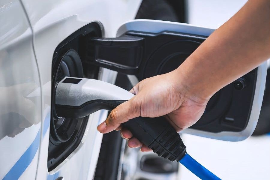 Plugging in EV charger