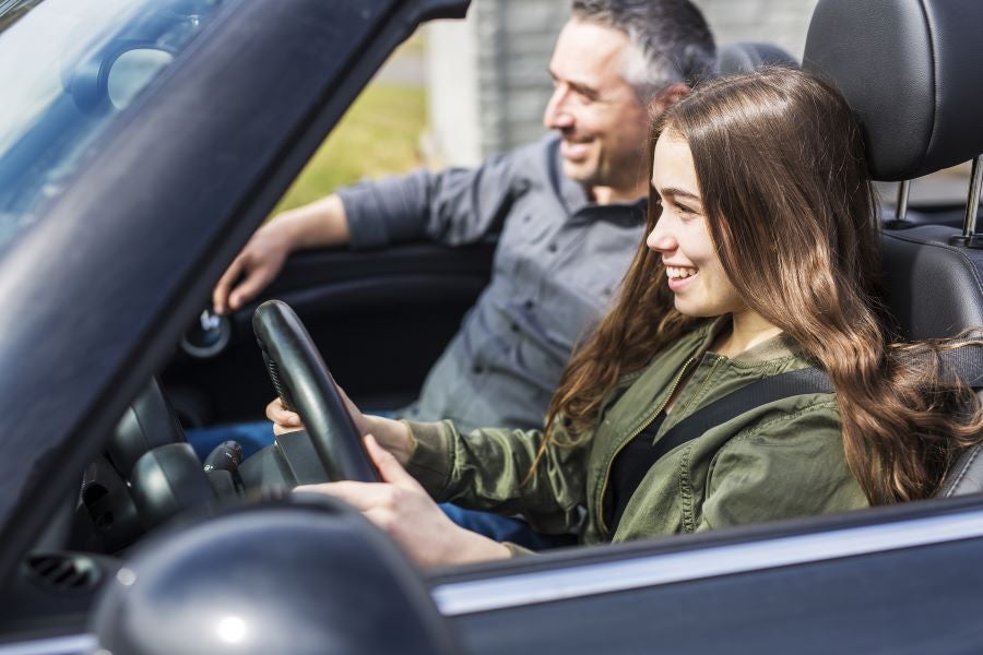 Girl happily driving